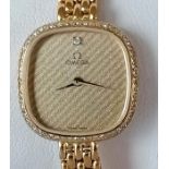 A vintage Omega ladies quartz 1387 wristwatch, circa 1990, with square striped face, 17mm