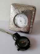 An Edwardian silver cased travel chrome-cased barometer with planished decoration by William Comyns,
