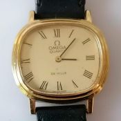 An Omega de Ville quartz gold plated gents wristwatch, push button style crown with replacement leat