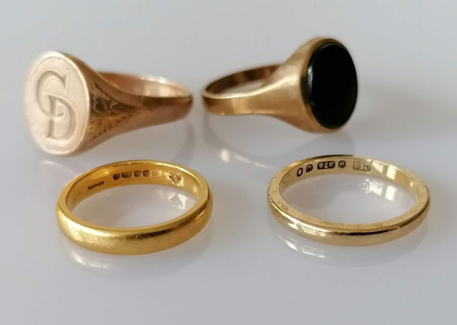 A 22ct yellow gold wedding band, size H, 3.78g; another 9ct gold, size K and 9ct two gents' signet r