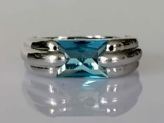 A single stone topaz ring, mixed-cut measuring 12 x 8 x 5mm d, calculated 4.85 carats