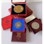 A Victorian cased bronze Jubilee Medal, 1887, 77mm; a cased 1902 Coronation Medal, two boxed silver