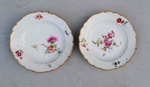 A pair of Meissen plates with floral decoration, fitted for hanging, double sword marks for 1775-17