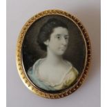 An early 19th century oval portrait miniature on ivory of Susan Metcalf, unsigned, in a gold frame