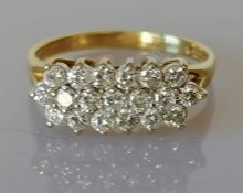 An 18ct yellow gold and diamond ring with three rows (19) of brilliant cut diamonds, total diamond w