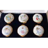 A cased set of six Crummles & Co. for Royal Doulton Beatrix Potter enamel pill boxes