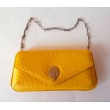 A Smythson yellow leather Mara clutch bag with detachable chain, silver tone fixtures, interior zip