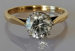 An 18ct yellow gold gem-set ring, 1.25 carats, in a basket setting, stamped, size O, 2.83g