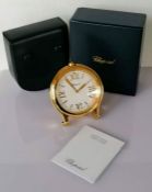 A Chopard Happy Sport table clock silvered dial with gilt quarterly Roman numerals, strut stand, ser