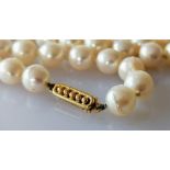 An Art Deco-style single row of seventy-seven cultured pearls measuring 7.15mm to 7.40mm