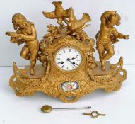 A 19th century French porcelain and ormolu mantel clock, the striking movement by Japy stamped for '