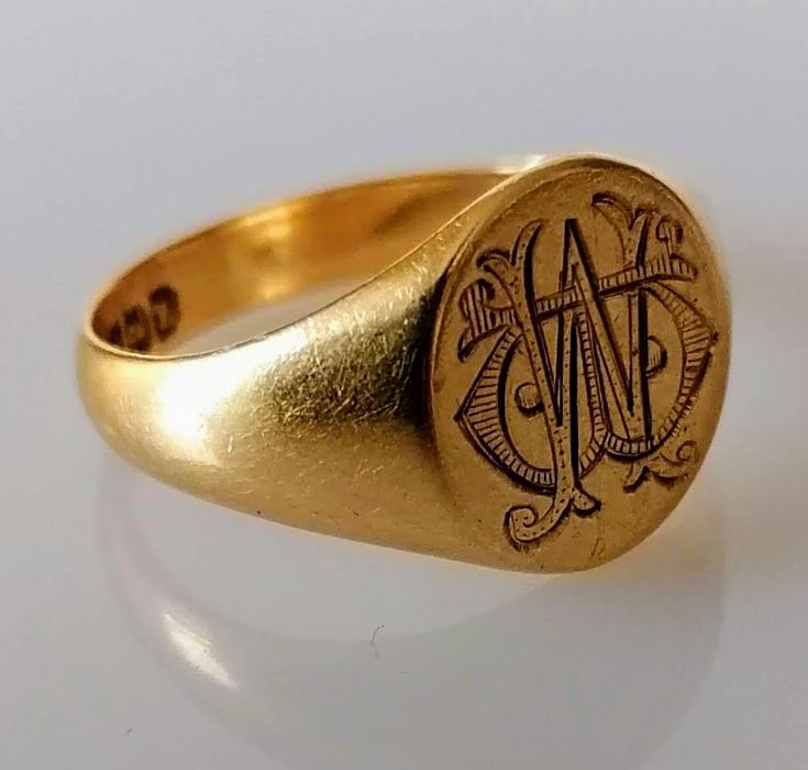 A George V gold signet ring, initialled and inscribed, size R, hallmarked 18ct, 6g