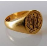 A George V gold signet ring, initialled and inscribed, size R, hallmarked 18ct, 6g