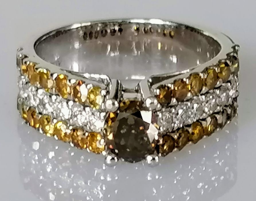 A diamond ring, the central yellowish brown diamond measuring an estimated 5.93 x 5 x 3.2mm, - Image 2 of 4