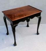 An Irish Georgian mahogany centre or silver table with dished top, shaped frieze, applied scallop mo
