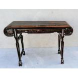 A 19th century Chinese hardwood altar table with ornately carved apron on both sides depicting drago