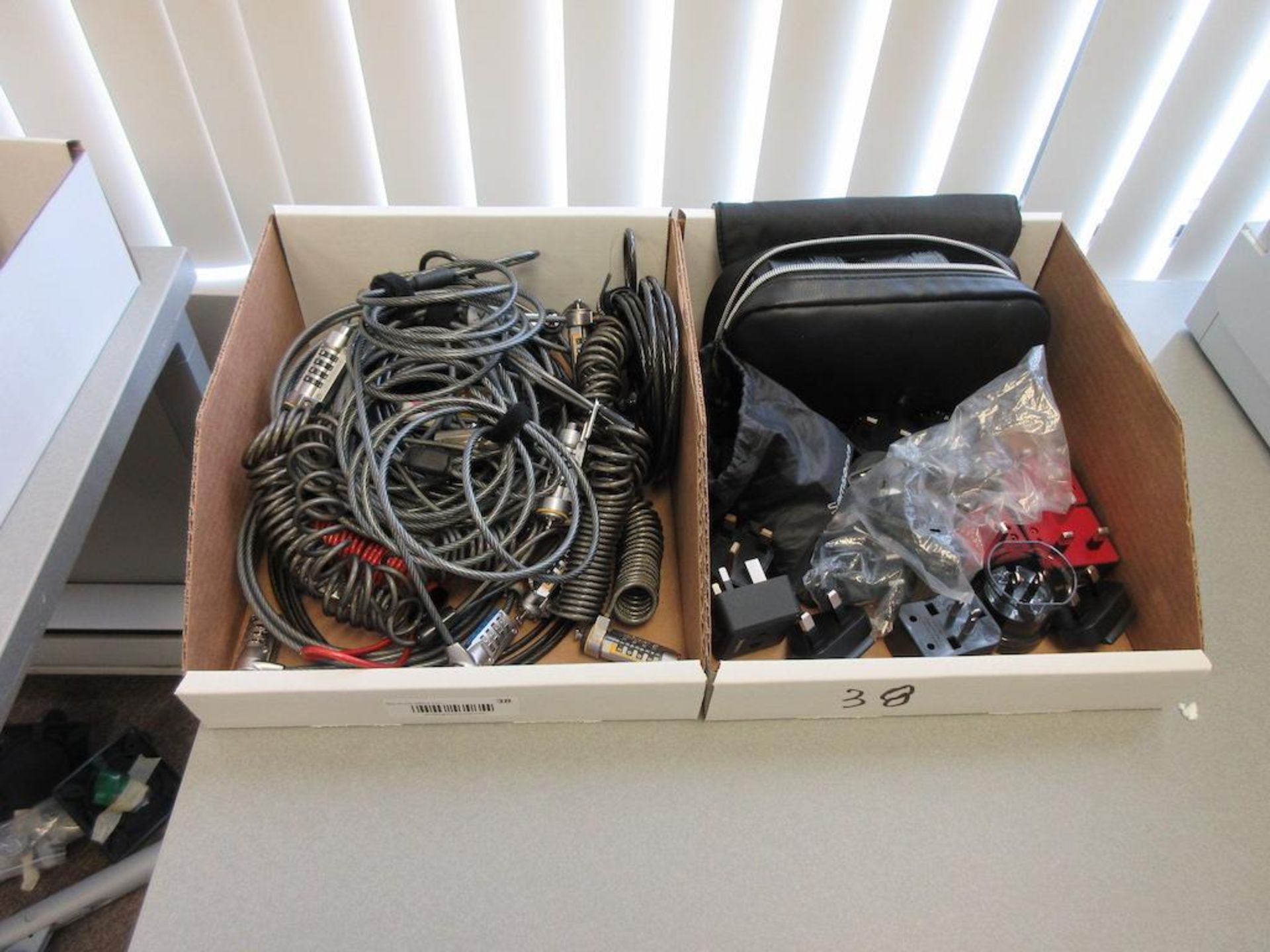 (1) BOX LAPTOP LOCKS, (1) BOX UNIVERSAL ADAPTORS