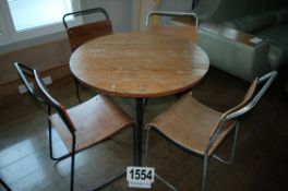 A Vintage Industrial Style Reclaimed Plank Topped Table 900mm Diameter on Tapered Metal Legs with 4: