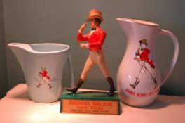 A Collection of JOHNNIE WALKER Memorabilia Comprising 2: Various Water Jugs and Plynth Mounted