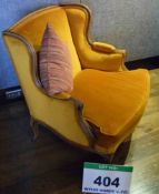 A Gold Velour Upholstered Short Back Wing Back Armchair on Carved Timber Framing