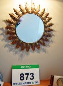 A Wall hung Circular Mirror with Brass Leaf Pattern Frame