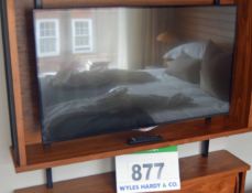 An LG 42UB820V 42 inch Smart Television Set on Articulated Wall Bracket with Hand Held Remote