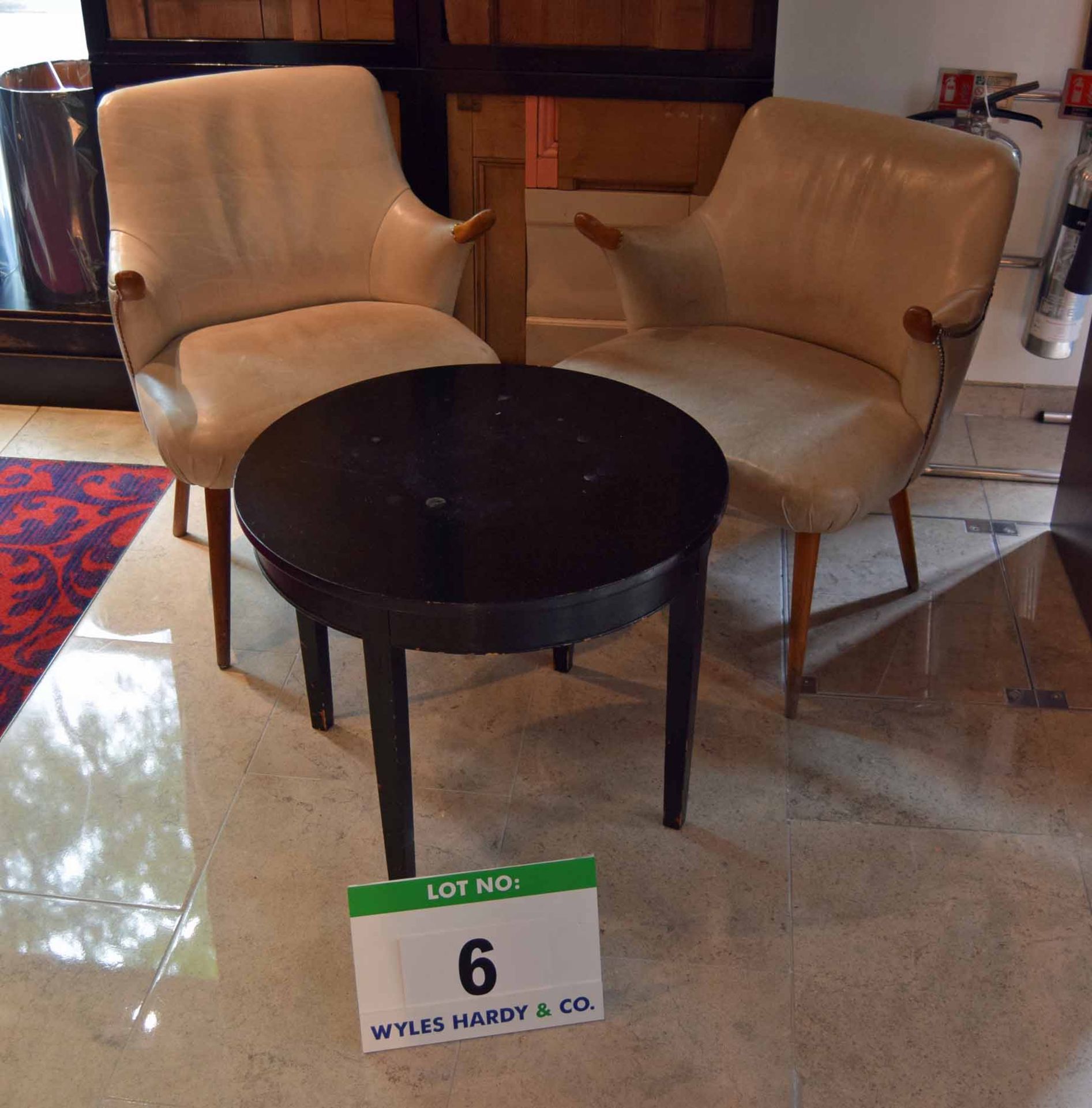 A Pair of matching Ivory Leather Upholstered Reception Armchairs with Brass Studding with a Black