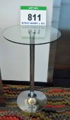 A 600mm dia. Circular Glass Topped Pedestal Table on Polished Stainless Steel Pedestal