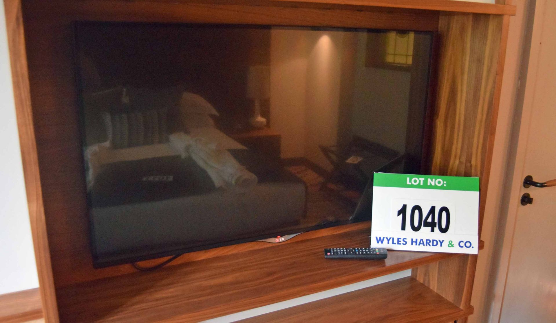 An LG 42UB820V 42 inch Smart Television on a Rigid Wall Bracket with Hand Held Remote Control