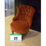 A Terracotta Velour Upholstered Victorian Style Button Back Salon Chair with Castor mounted Front