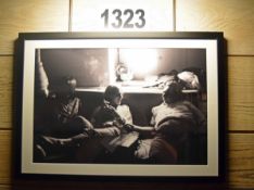 A Framed and Glazed Wall Mounted Black and White Photographic Print Depicting the Recording of a