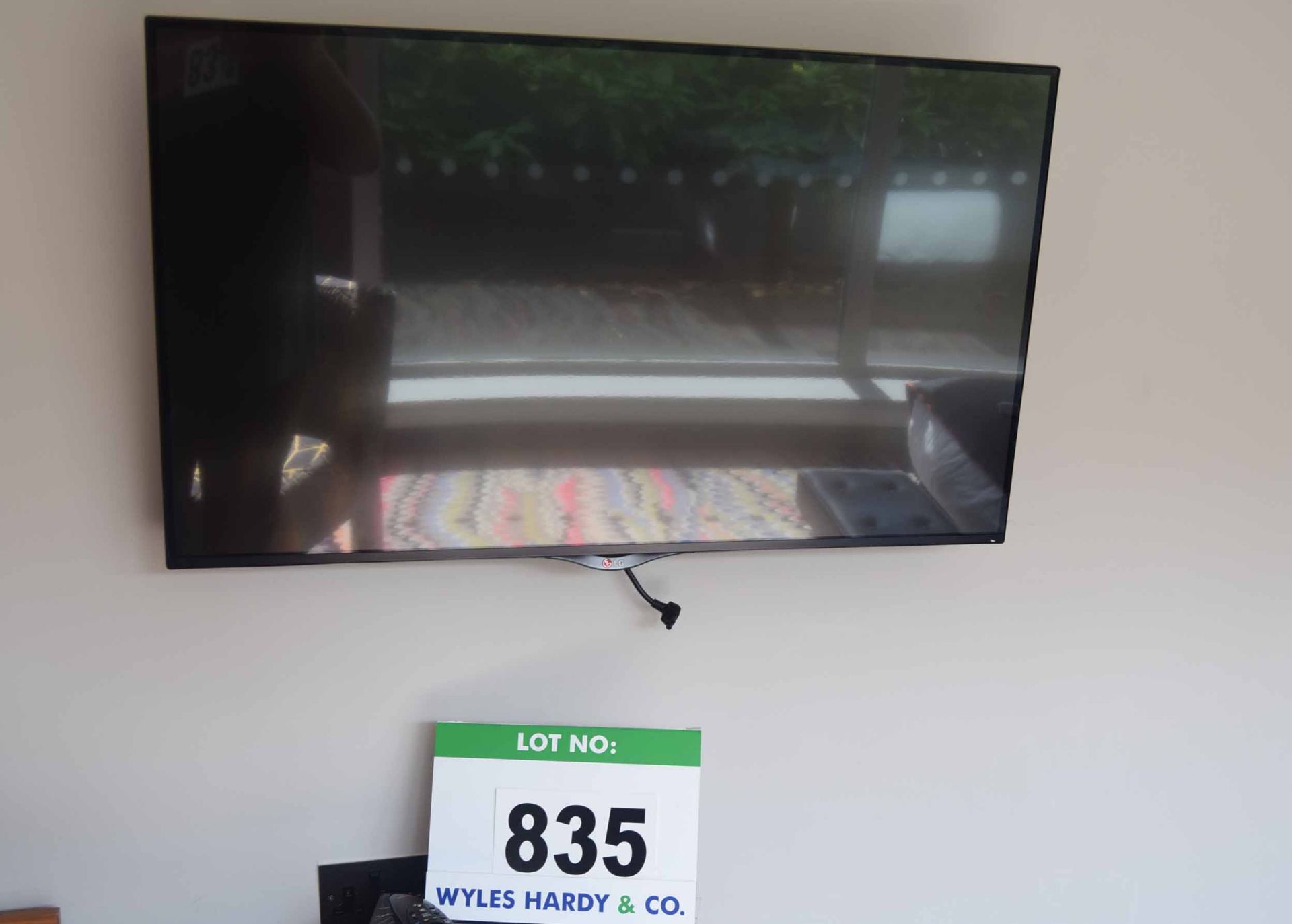 An LG 42UB820V 42 inch Smart Television on an Articulated Wall mount with Hand Held Remote