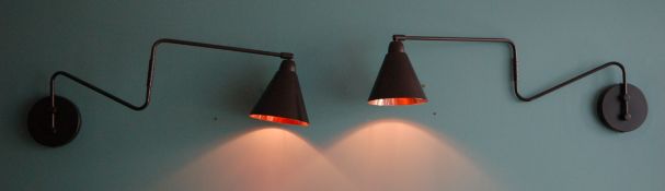 A Pair of Black Painted Metal Wall Lights Having Hinged 2-Section Extending Arm and Conical Shade