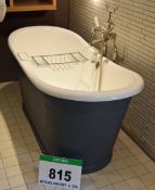A Victorian Style Free Standing White Enamelled Cast Metal Roll-Topped Bath Tub on Grey Metal Base