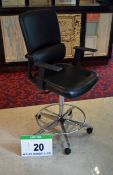 A PARITY Black Leatherette Upholstered Castor mounted Gas Lift Executive Draughtsmans Chair with