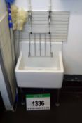 An ARMITAGE SHANKS White Ceramic Sluicing Sink with Integrated Bucket Stand. (Risk Assessment and