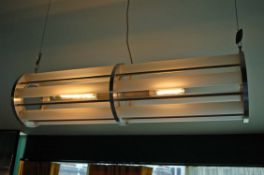 A Tube Form Twin Bulb Suspended Ceiling Light Having Turned Alloy Centre and End Plates with