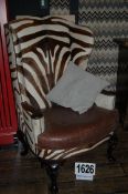 An Imitation Zebra Skin Upholostered Wing Back Arm Chair with Brown Leather Removable Seat Cushion