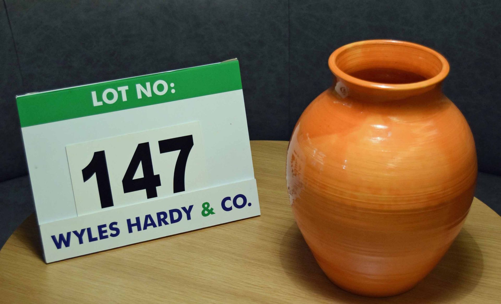 An Orange Glazed Pottery Vase bearing a Potters Mark 'KN' on the Base, 255mm tall x 210mm at