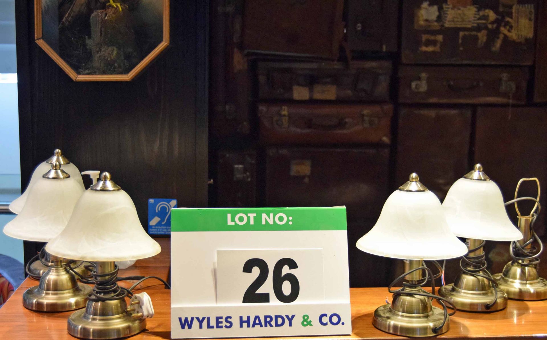 Five Antique Brass Effect Restaurant Table Lamps with Opaque Glass Shades and a spare base for same.