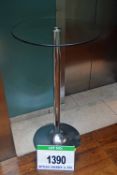 A Circular Glass Pedestal Table 600mm Diameter on a Polished Metal Pedestal