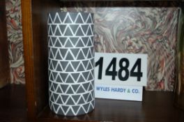 A Grey and White Sculpted Pattern Tube Shaped Ceramic Vase