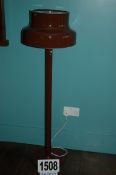 A Brown Painted Metal Floor Lamp