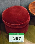 A Red Velour Upholstered Muffin Topped Pouffe