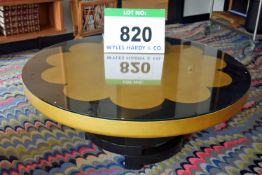 A 1000mm dia. Circular Coffee Table having Black Lacquered Timber Pedestal on Glass Covered Gold and