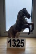 A Paper Mache Figurine of a Rearing Horse