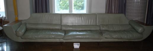 A Green Leather Upholstered 6-Seater Settee with Removable Seat Cushions and Bolster Lumbar Cushions