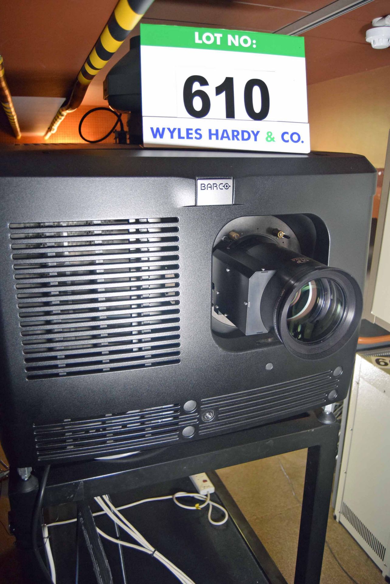 A BARCO DP4K-19B Digital Film Projector with DOLBY DFC100 Filter Controller on Heavy Steel Track