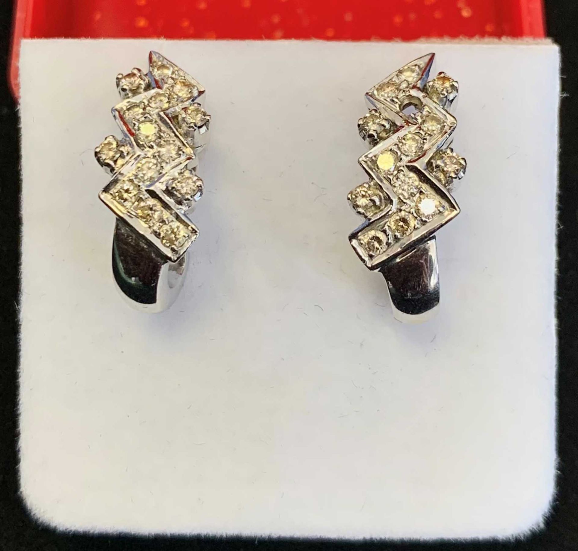 Pair of Contemporary Earrings, In white Metal Set with Diamonds. 1 with Missing Stone, 7.410 grams