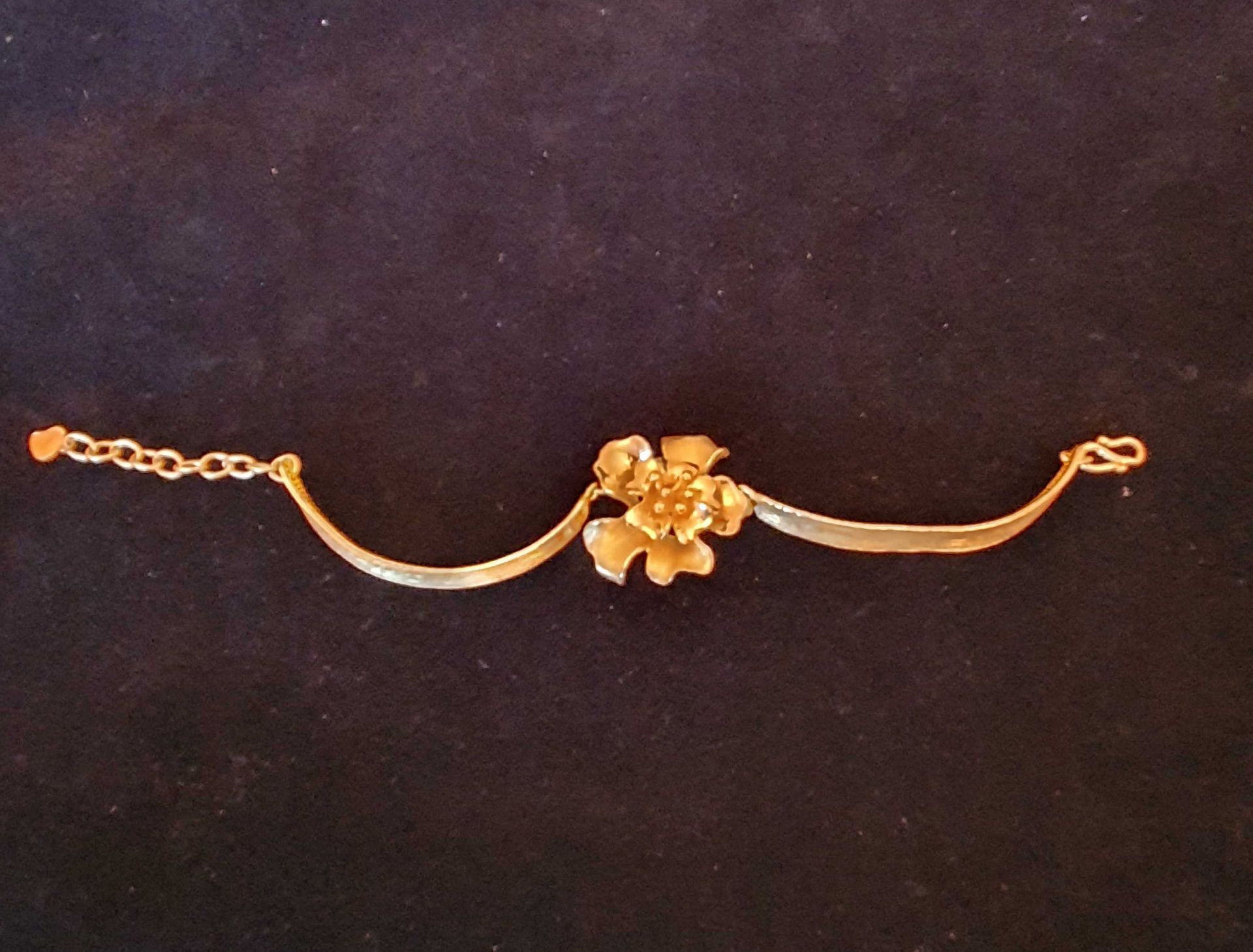 Gold Metal Bar Bracelet with Central Rose Motif. Chain Tag Marked .999 24 Carat 22.095 grams